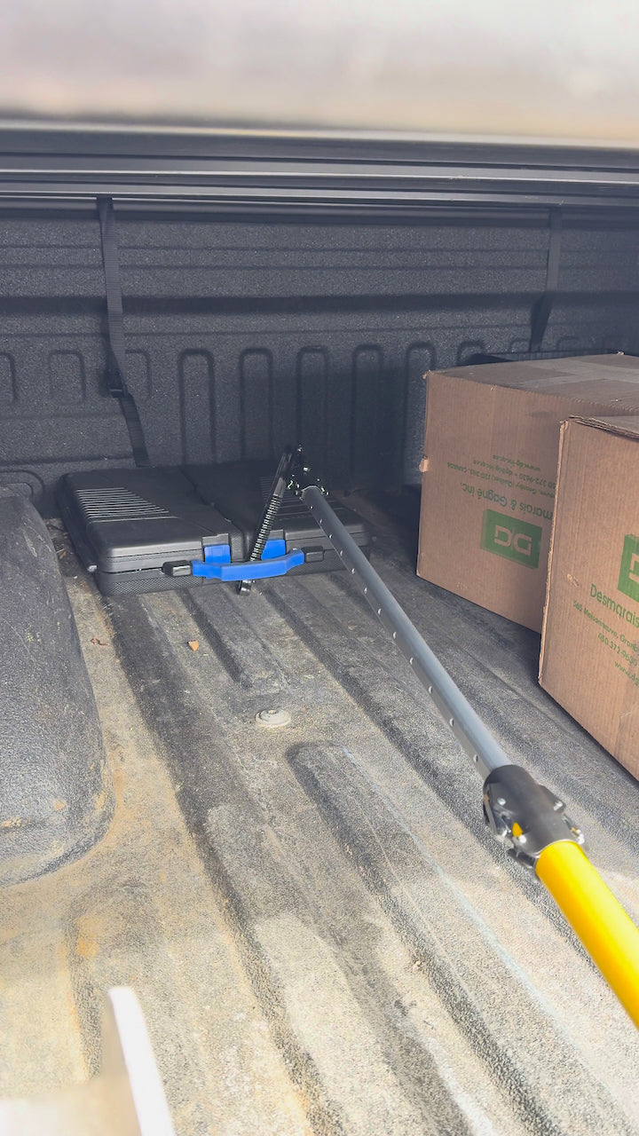 Cargo Pro Hook reaching a toolbox at the front of a pickup truck bed