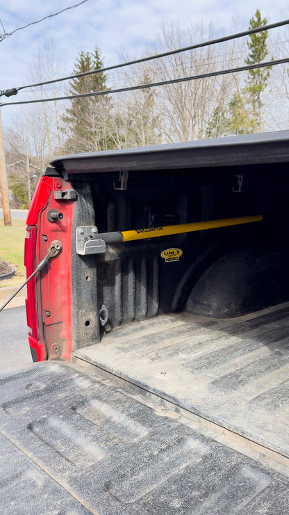 Cargo Pro Hook stored on its brackets inside a pickup truck bed